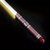 a star wars light saber on a black surface